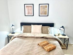 En eller flere senge i et værelse på Apartamento La Maquinilla