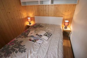 Tempat tidur dalam kamar di Schuss Appartements VTI