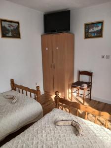 Giường trong phòng chung tại Maja Apartman +14 ảnh