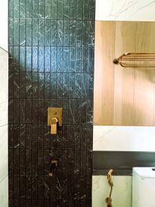 Koupelna v ubytování Hotel Aarka + 36 fotografií