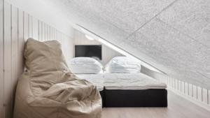 En eller flere senge i et værelse på Villavilla #601 - Rømø, Sydjylland + 21 billeder