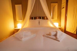 Postel nebo postele na pokoji v ubytování Stone View Nest - By Ski Alure