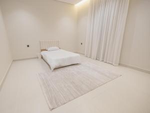 Giường trong phòng chung tại دار العقيق 101