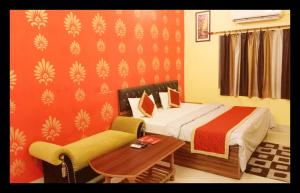 En eller flere senge i et værelse på The Aditya Inn