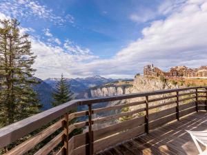 a wooden balcony with a view of the mountains at Chalet d'exception 7 pièces pour 12 pers. à Avoriaz - FR-1-314-243 in Avoriaz