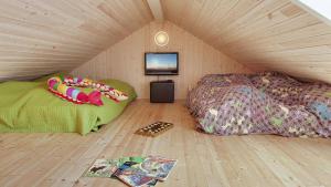 En eller flere senge i et værelse på Villavilla #287 - Lohals, Fyn Og Øer + 7 billeder