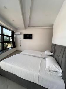 a bedroom with a large bed and a couch at Tanger sun studios in Tangier