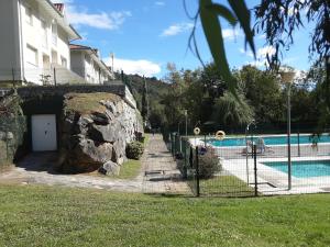 a house and a swimming pool with a building at Entrecuevas - Rural Accommodation in Arredondo