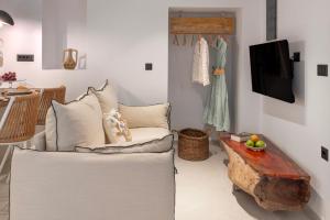 a living room with a chair and a table at stema suite 1 in Tripiti