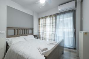 En eller flere senge i et værelse på Annita's Cozy Loft Volos