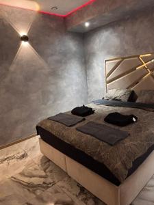 Postel nebo postele na pokoji v ubytování Le Palais Du Khalif