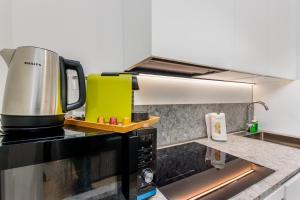 Kuchyň nebo kuchyňský kout v ubytování Bergamo Center BGYnn Balcony Suite + 17 fotografií