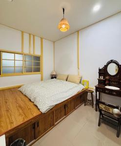 Postel nebo postele na pokoji v ubytování 沐時光民宿