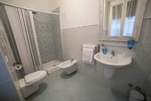 a bathroom with a toilet and a sink at Blunotte Potenza in Potenza