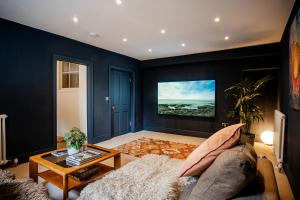 a living room with a couch and a table at BATH Luxury Georgian Flat in Bath