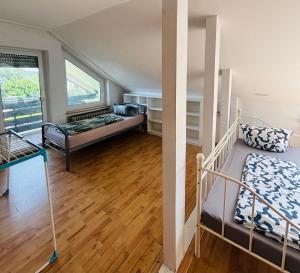 a bedroom with two bunk beds and a balcony at GMA Apartment T4 in Kappel-Grafenhausen
