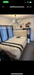 a bedroom with a large bed in a room at Premiership Lodge in Beeston Hill +3 photos