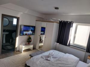 En eller flere senge i et værelse på Casa Capibarei 3