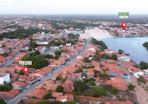 an aerial view of a city with a beach and balloons at Pousada Cactus in Barreirinhas +25 photos