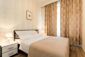 En eller flere senge i et værelse på The Tbilisi Crest