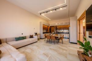 a living room with a couch and a table at Villa Soliya 4 Rooms with private pool in Marrakesh
