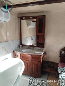 a bathroom with a sink and a mirror at ARIANA home in Turda +4 photos