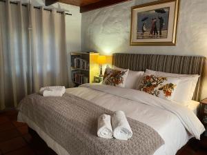 Postel nebo postele na pokoji v ubytování Maggie Rose Cottage