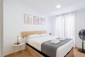 Ένα ή περισσότερα κρεβάτια σε δωμάτιο στο Apartamento Completo junto playa y Centro Bcn