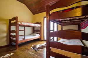 En eller flere senge i et værelse på SOSSEGO AO PÉ DA SERRA - UM PARAÍSo