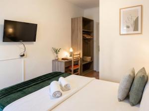 Voodi või voodid majutusasutuse Center Tirana Rooms toas