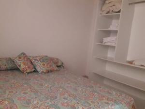 a bedroom with a bed with pillows on it at Departamento ALEM in Federación