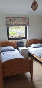 Postel nebo postele na pokoji v ubytování Carrick Chalets - 1