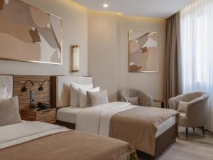 Postel nebo postele na pokoji v ubytování Kazakhstan Hotel