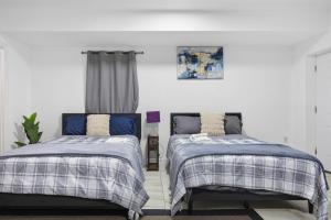 En eller flere senge i et værelse på Big Group Ready • 2 Kitchens / Sleeps 18