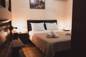 Postel nebo postele na pokoji v ubytování stratigato