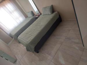 En eller flere senge i et værelse på Infinity Guesthouse + 3 billeder