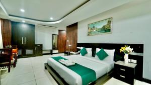 Ένα ή περισσότερα κρεβάτια σε δωμάτιο στο Corporate stays-Suncity