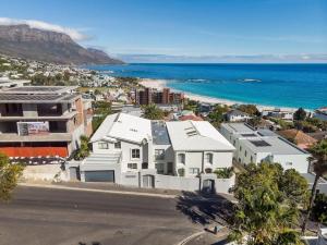 an aerial view of a city and the ocean at Luxury Camps Bay Getaway in Cape Town