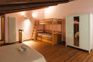 a bedroom with two bunk beds and a ladder at Al Casolare in Ofena +37 photos