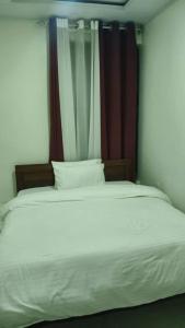 Giường trong phòng chung tại 3 bedroom apartments in Kigali