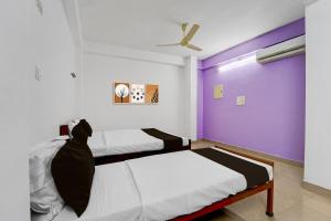 Ένα ή περισσότερα κρεβάτια σε δωμάτιο στο Hotel O HEAVEN REGENCY