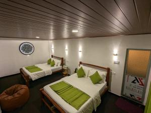 En eller flere senge i et værelse på Ella Morning Sunshine