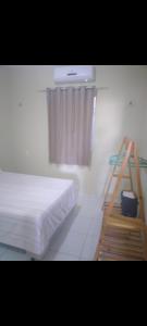 Postel nebo postele na pokoji v ubytování Terraço Muniz