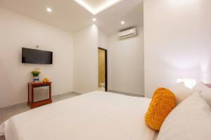 Et tv og/eller underholdning på Golden Sun Hotel Hoi An + 37 billeder