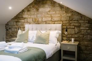 En eller flere senge i et værelse på Sun Street Retreats