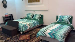 En eller flere senge i et værelse på Villa Soleil, Face à la Mer C5