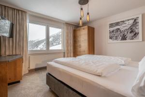 Postel nebo postele na pokoji v ubytování Hotel Olympia