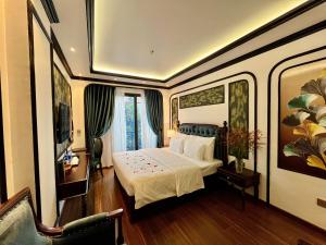 a bedroom with a white bed in a room at Royal Hotel Hà Nội in Lưu Phái