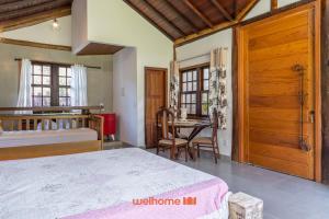 En eller flere senge i et værelse på Corrego da Luz Triplo