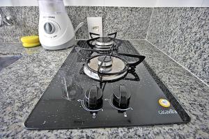 a stove top oven sitting on top of a counter at Rio Spot Ipanema C011 in Rio de Janeiro +18 photos